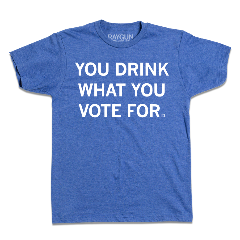 Short-sleeve heather royal blue t-shirt with centered white text that says, "You Drink What You Vote For" in all caps.