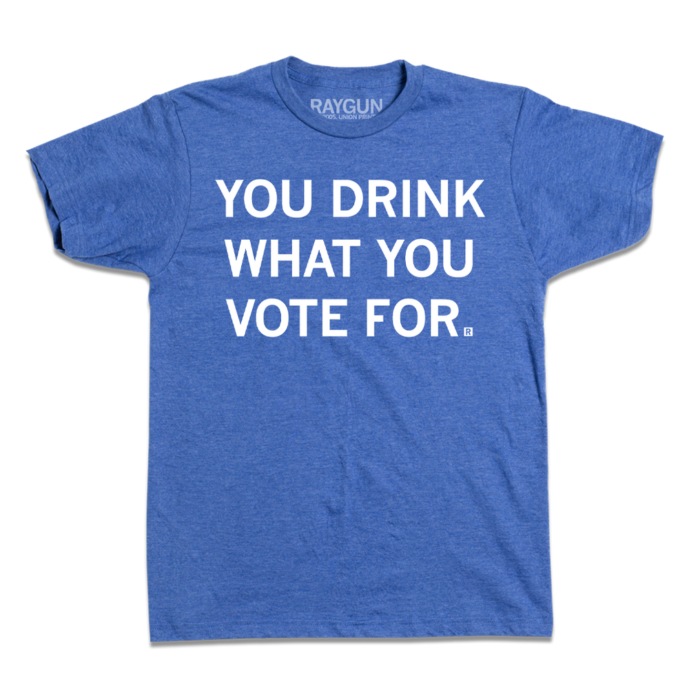 Short-sleeve heather royal blue t-shirt with centered white text that says, "You Drink What You Vote For" in all caps.