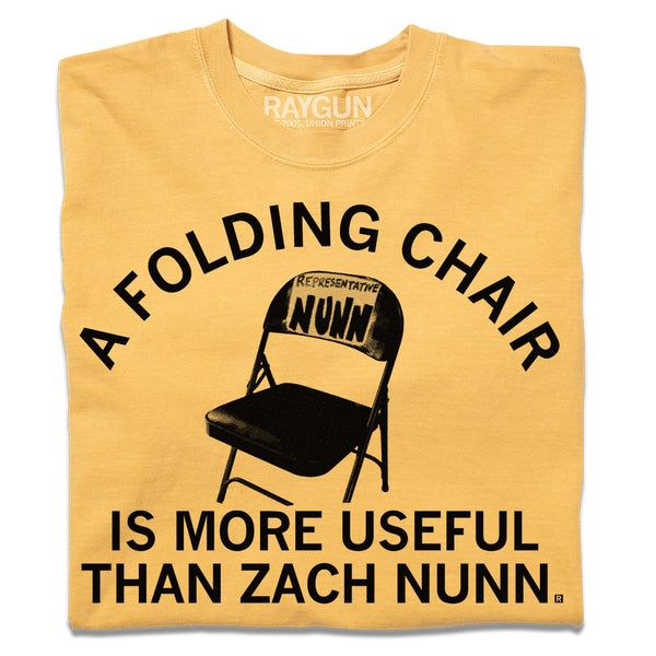 A folded mustard gold shirt with the text 
