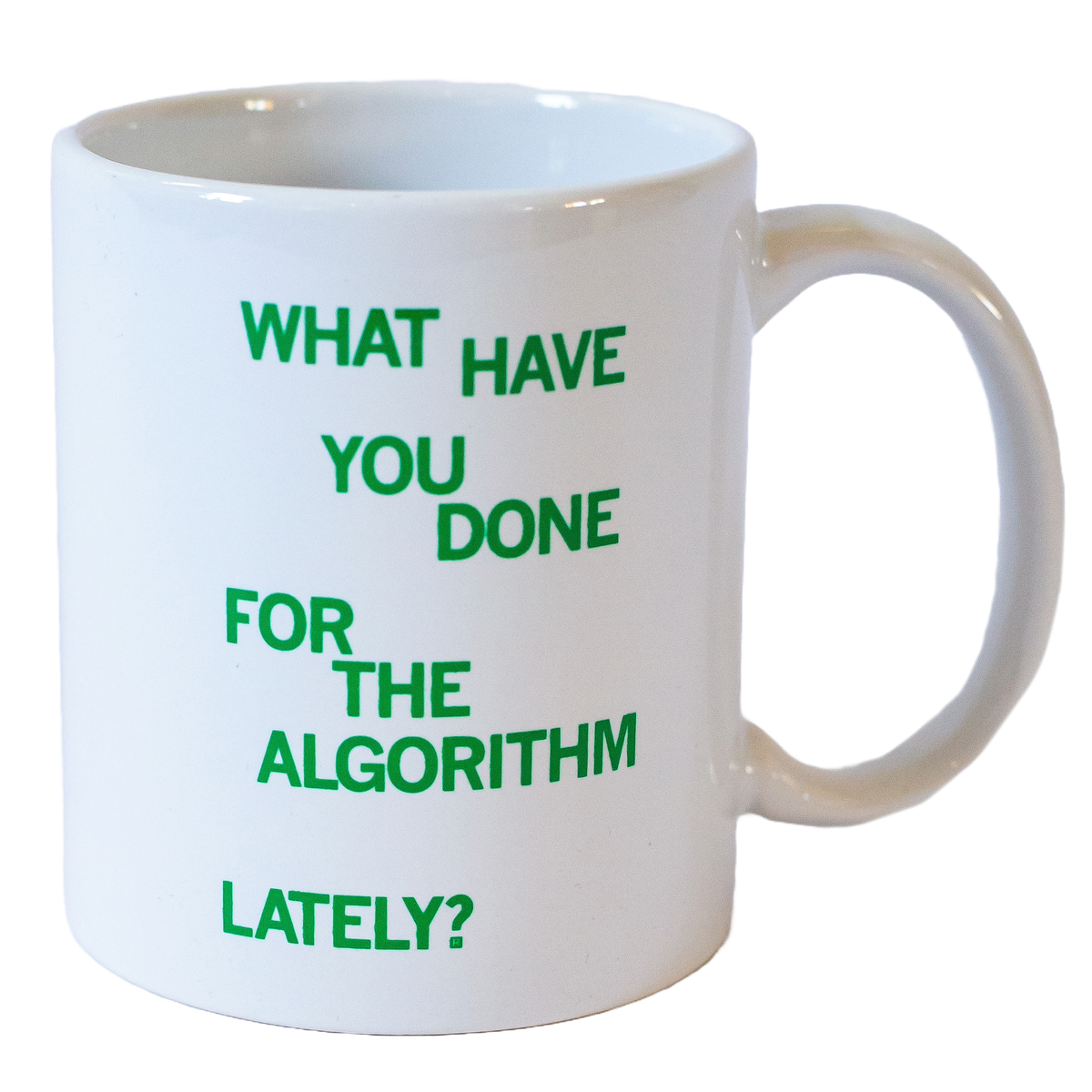 A white RAYGUN coffee mug with the green text: WHAT HAVE YOU DONE FOR THE ALGORITHM LATELY?.