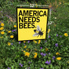 A 12-inch, made in the USA yellow yard sign stands in a field of wildflowers, featuring an illustration of a honeybee and the text AMERICA NEEDS BEES.