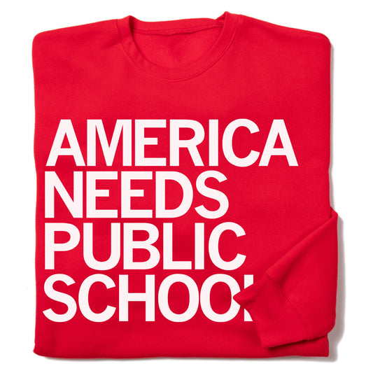 Red, union-made crew sweatshirt with white text that reads, AMERICA NEEDS PUBLIC SCHOOLS.