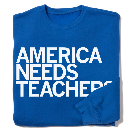 Union-made blue crewneck sweatshirt with the white text AMERICA NEEDS TEACHERS printed on the front.