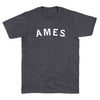 Charcoal gray short-sleeve crewneck t-shirt with AMES printed in white capital letters across the chest, representative of Ames, Iowa.