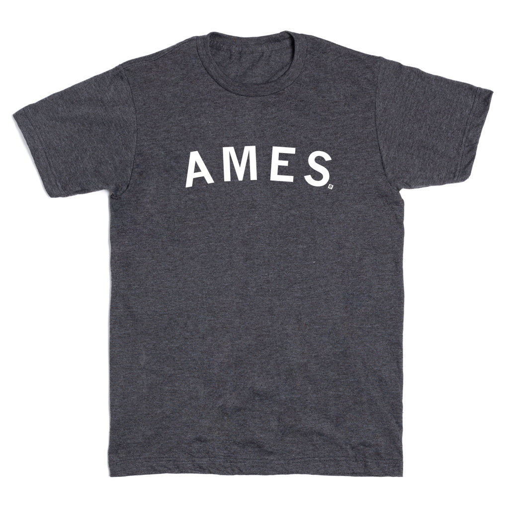Charcoal gray short-sleeve crewneck t-shirt with AMES printed in white capital letters across the chest, representative of Ames, Iowa.
