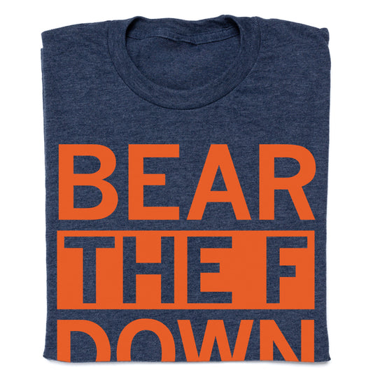 A folded heather denim t-shirt with the orange text BEAR THE F DOWN printed on the front.