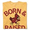 Yellow RAYGUN heavyweight T-shirt with the text BORN & RAISED in maroon, featuring a graphic of an Iowa State cardinal mascot wearing an I jersey and shoes.