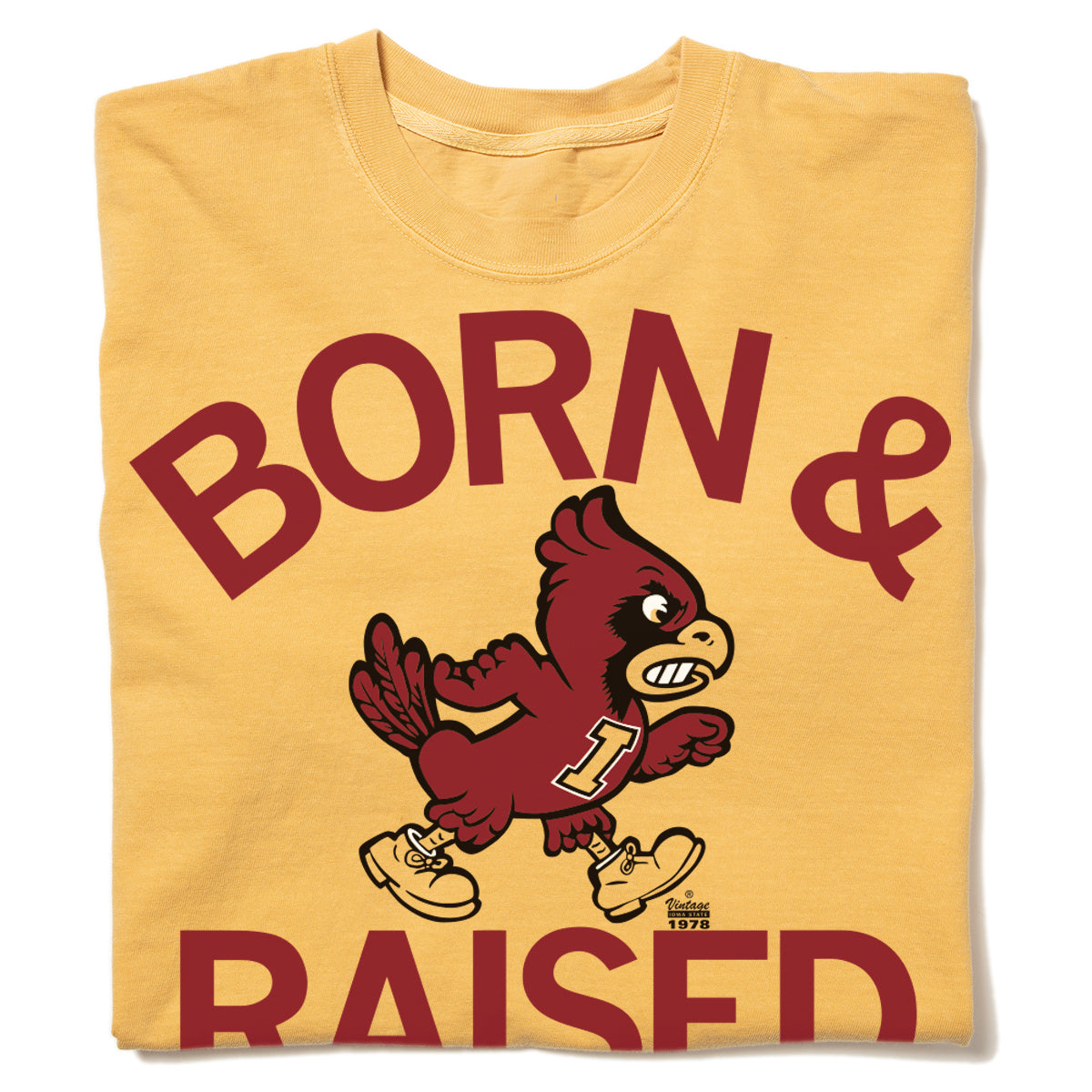 Yellow RAYGUN heavyweight T-shirt with the text BORN & RAISED in maroon, featuring a graphic of an Iowa State cardinal mascot wearing an I jersey and shoes.