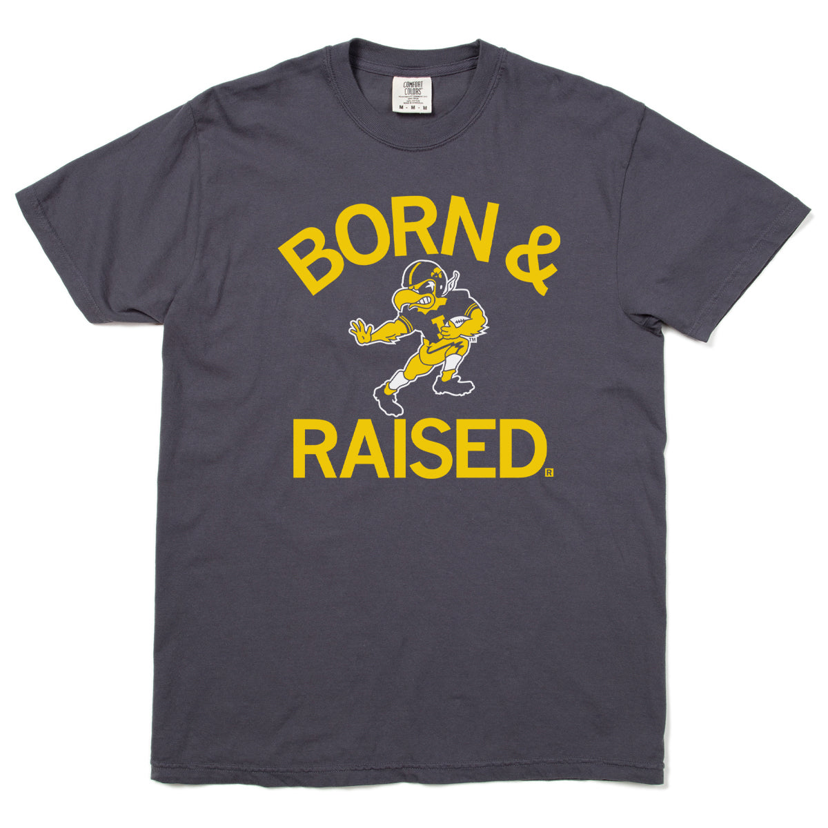 Dark gray, union-made Hawkeye t-shirt with short sleeves, featuring BORN & RAISED printed in yellow text surrounding a cartoon football player mascot.