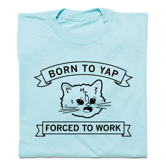 Heather purist blue T-shirt featuring a graphic of Gary the Cat with the text BORN TO YAP above it and FORCED TO WORK below it inside banners.