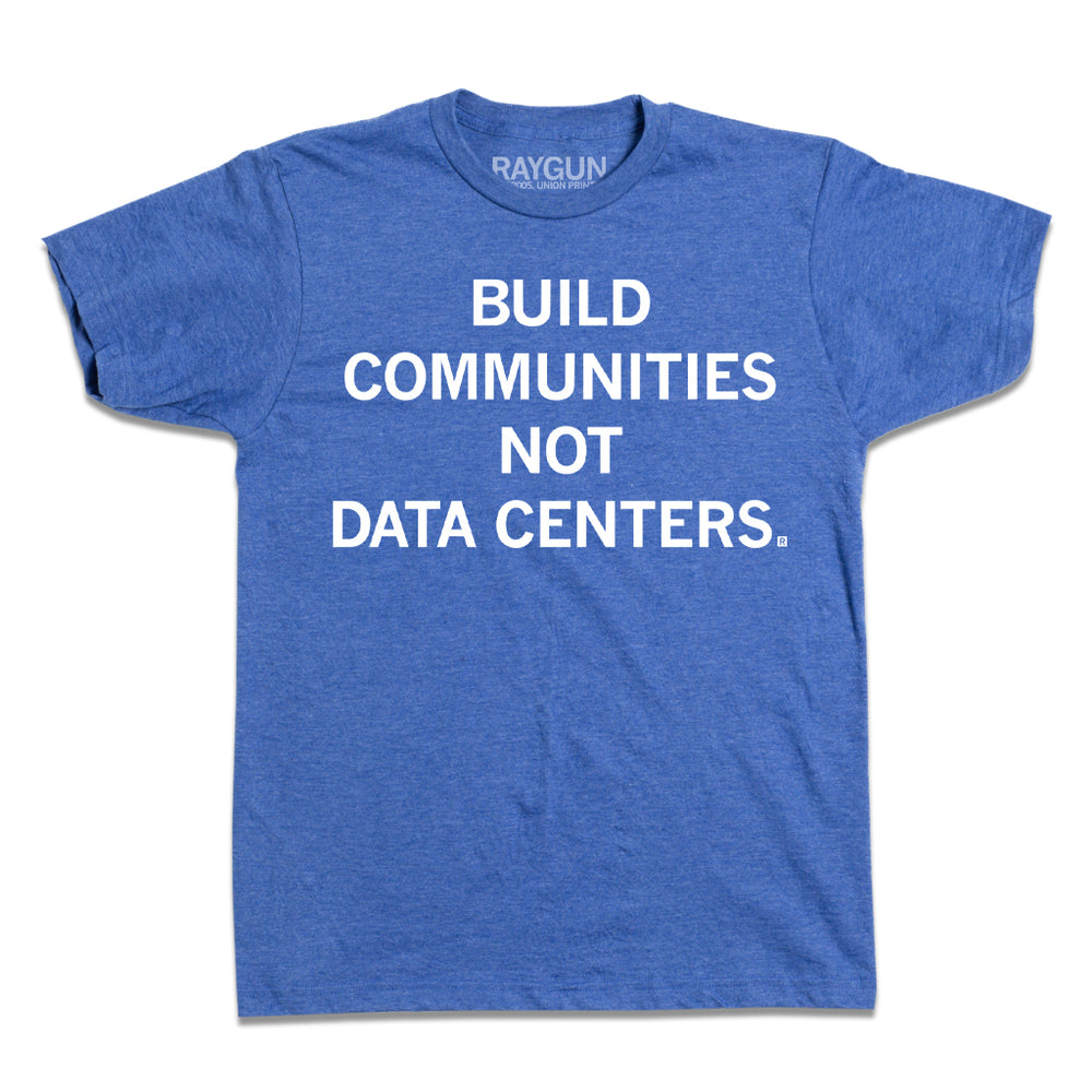 A heather royal t-shirt with white ink text that reads "Build Communities Not Data Centers."