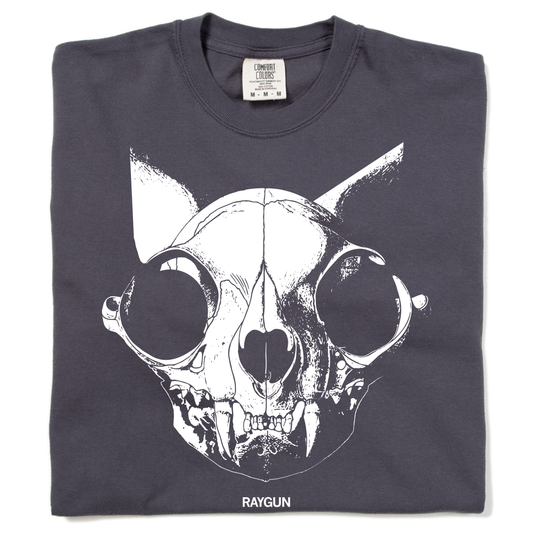 Heavyweight cotton dark gray crewneck t-shirt featuring a large white graphic of a cat skull and the word RAYGUN printed at the bottom.