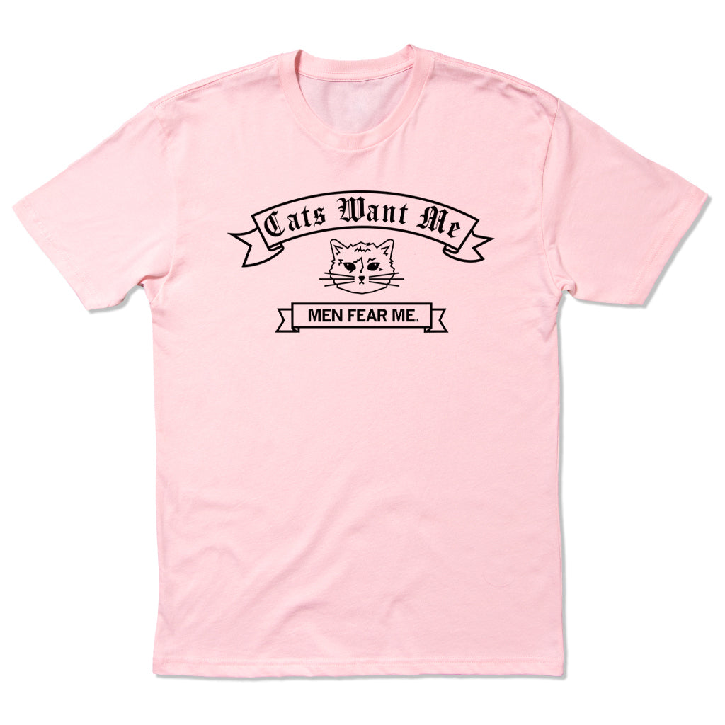 A light pink cat t-shirt featuring a graphic of a cat face with the text Cats Want Me and MEN FEAR ME. on ribbons.