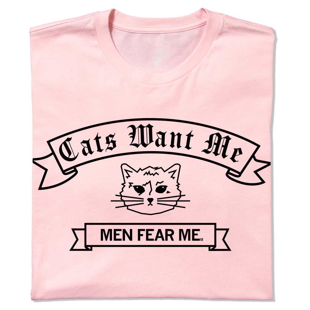 Light pink union-made t-shirt featuring a black graphic of a cat face between two banners that read Cats Want Me and MEN FEAR ME.