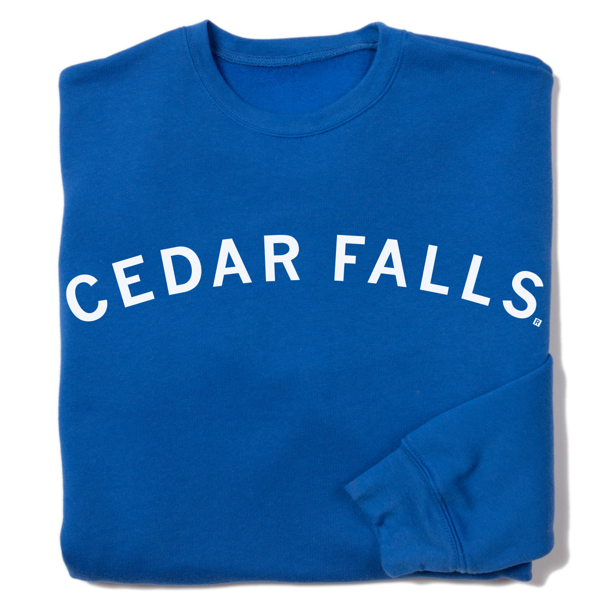 Blue union-made crewneck sweatshirt with CEDAR FALLS printed in white arching text across the chest.