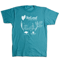 A teal t-shirt with white ink print depicting the Cedar Rapids skyline with text above that says, "ReLeaf Cedar Rapids" and below with the Trees forever logo and Cedar Rapids City of Five Seasons logo.