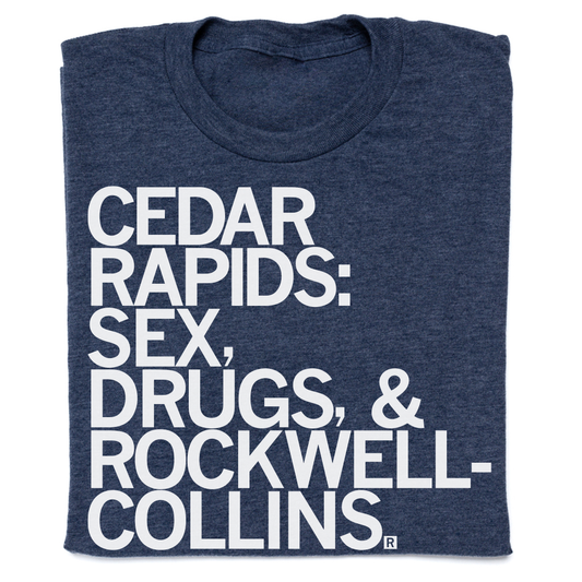 Heather denim blue t-shirt with white text reading CEDAR RAPIDS: SEX, DRUGS, & ROCKWELL-COLLINS.