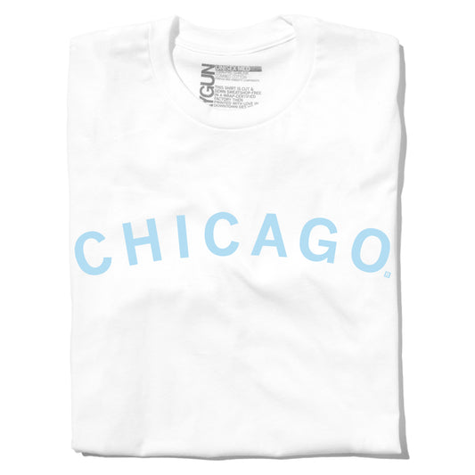 White union made t-shirt folded with the word CHICAGO printed in light blue across the chest.