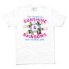 White Pride t-shirt with a graphic of a street intersection labeled The Corner of Sunshine & Rainbows and East Village, DSM, featuring colorful rainbow-themed street signage.