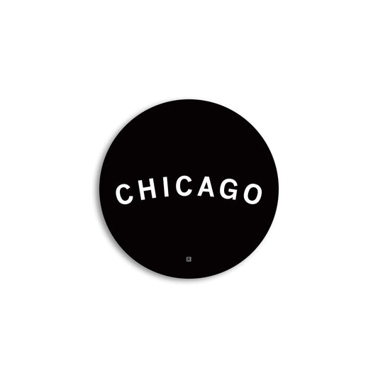 A black circular RAYGUN Chicago vinyl sticker featuring the word CHICAGO in capitalized white text.