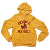 Heather mustard pullover hoodie featuring a graphic that reads BORN & RAISED with a cartoon cardinal mascot.