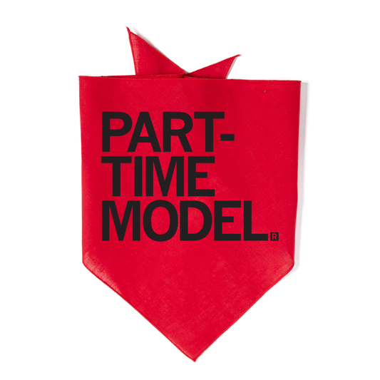 Bright red cotton dog bandana with the text PART-TIME MODEL printed in black letters.
