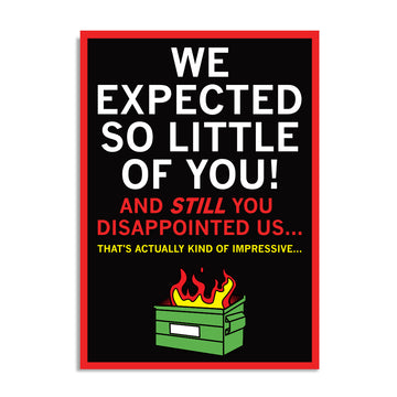 A black postcard with white, red, and gold text that says, "We Expected So Little of You! And STILL you disappointed us... That's actually kind of impressive..." above an illustration of a dumpster fire.