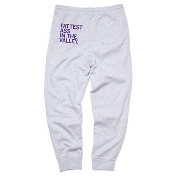 Relaxed fit heather grey sweatpants with FATTEST ASS IN THE VALLEY printed in purple on the back.