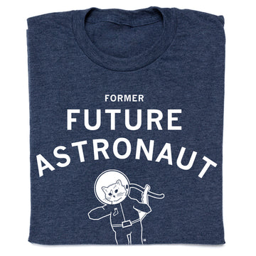 Dark blue RAYGUN apparel t-shirt with text that reads FORMER FUTURE ASTRONAUT above a graphic of a cat wearing a space helmet.
