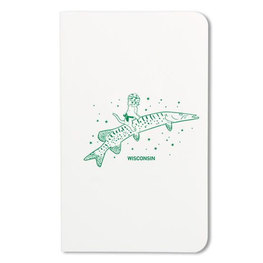 Notebook with kelly green illustration of a cat wearing a cheese hat while riding a musky fish.