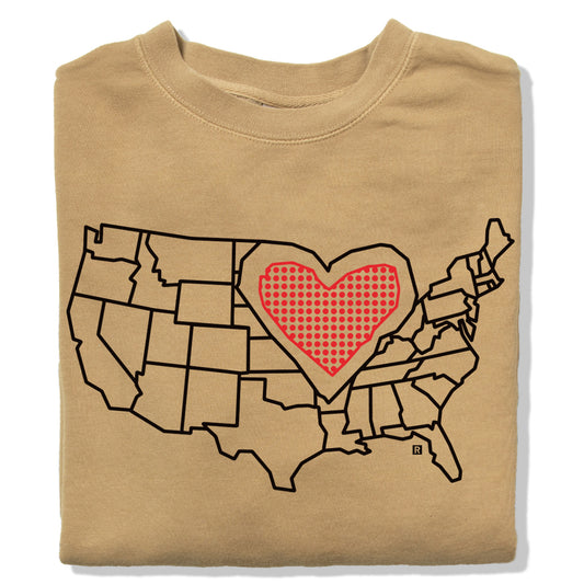 Tan RAYGUN sweatshirt featuring a black outline map of the United States with a red heart made of dots over the Midwest.