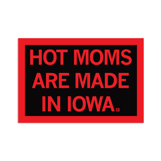 A rectangular RAYGUN vinyl sticker with a black background and a red border, reading HOT MOMS ARE MADE IN IOWA in red capital letters.