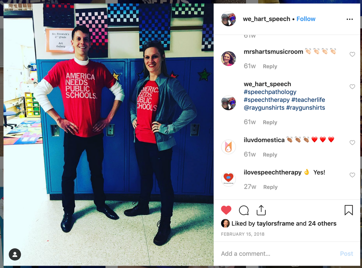 A man and a woman stand in front of blue lockers, both wearing union-made t-shirts that read America Needs Public Schools.