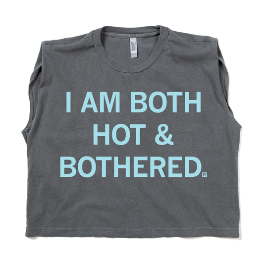 Charcoal gray garment-dyed muscle crop top featuring the text I AM BOTH HOT & BOTHERED. in light blue letters.