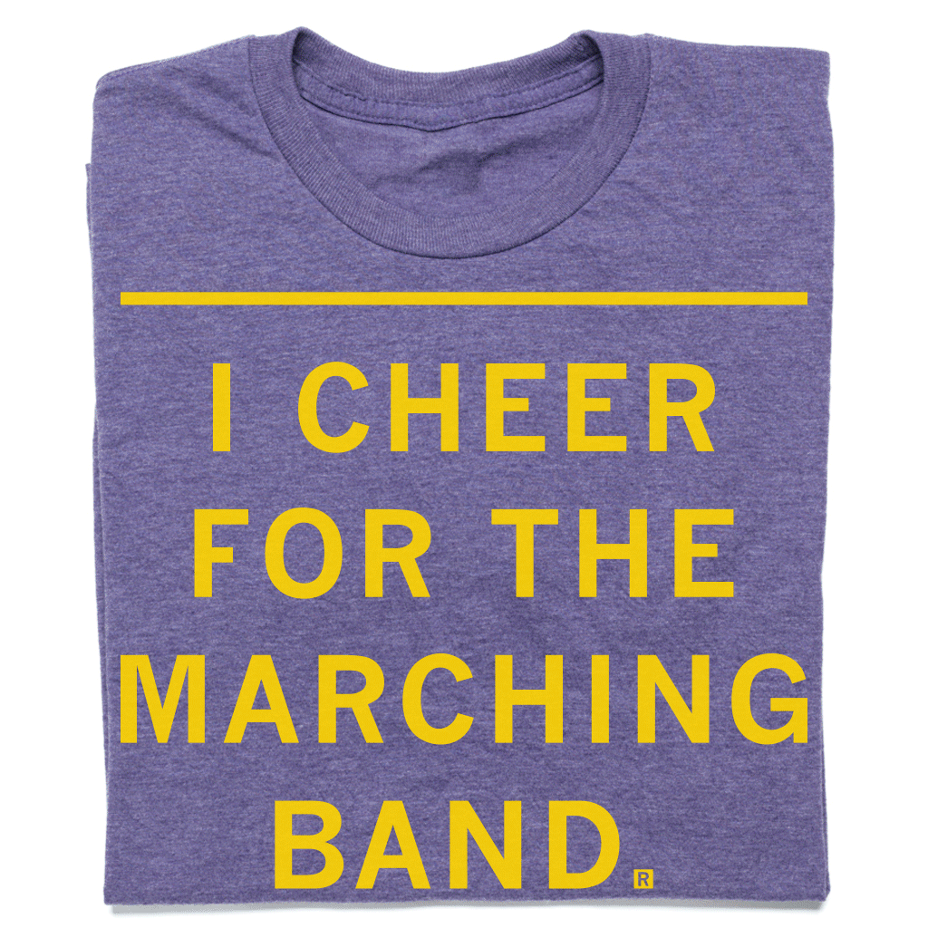 Heather purple t-shirt featuring the yellow text I CHEER FOR THE MARCHING BAND.