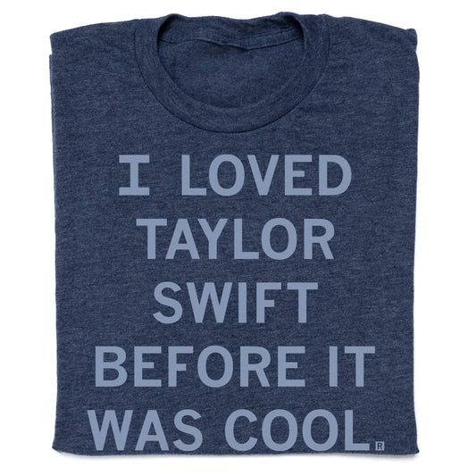 A heather denim Taylor Swift t-shirt featuring the text I LOVED TAYLOR SWIFT BEFORE IT WAS COOL.