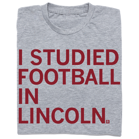 Grey union made t-shirt with the red text I STUDIED FOOTBALL IN LINCOLN.