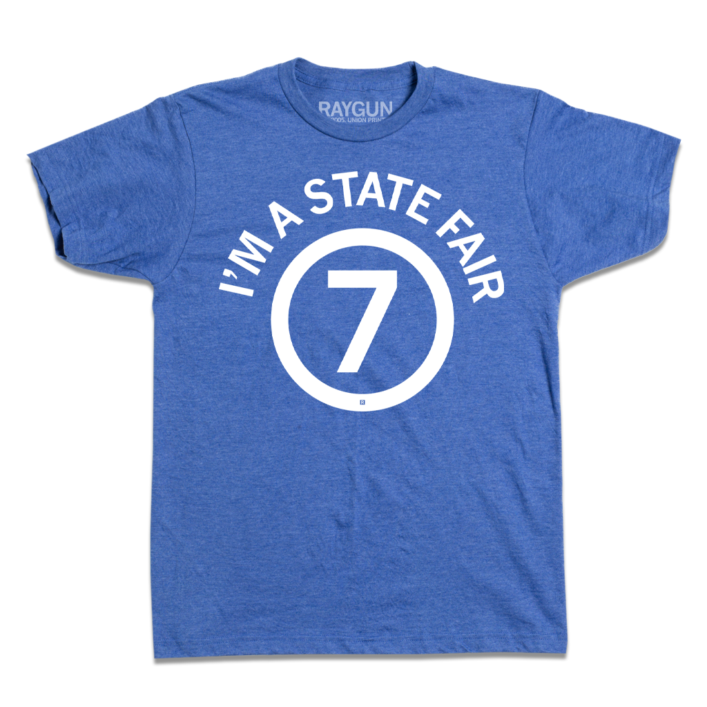 Heather royal blue t-shirt with a white circular graphic that reads IM A STATE FAIR 7.