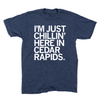 Heather denim crewneck t-shirt with white text that reads, IM JUST CHILLIN HERE IN CEDAR RAPIDS.