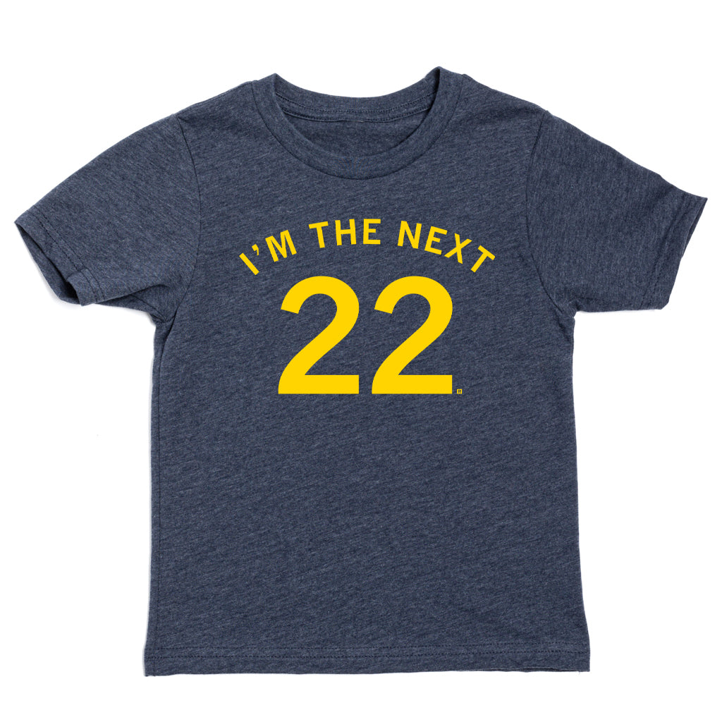 Dark gray, union-made short-sleeved T-shirt with the golden yellow text IM THE NEXT 22 printed on the chest.