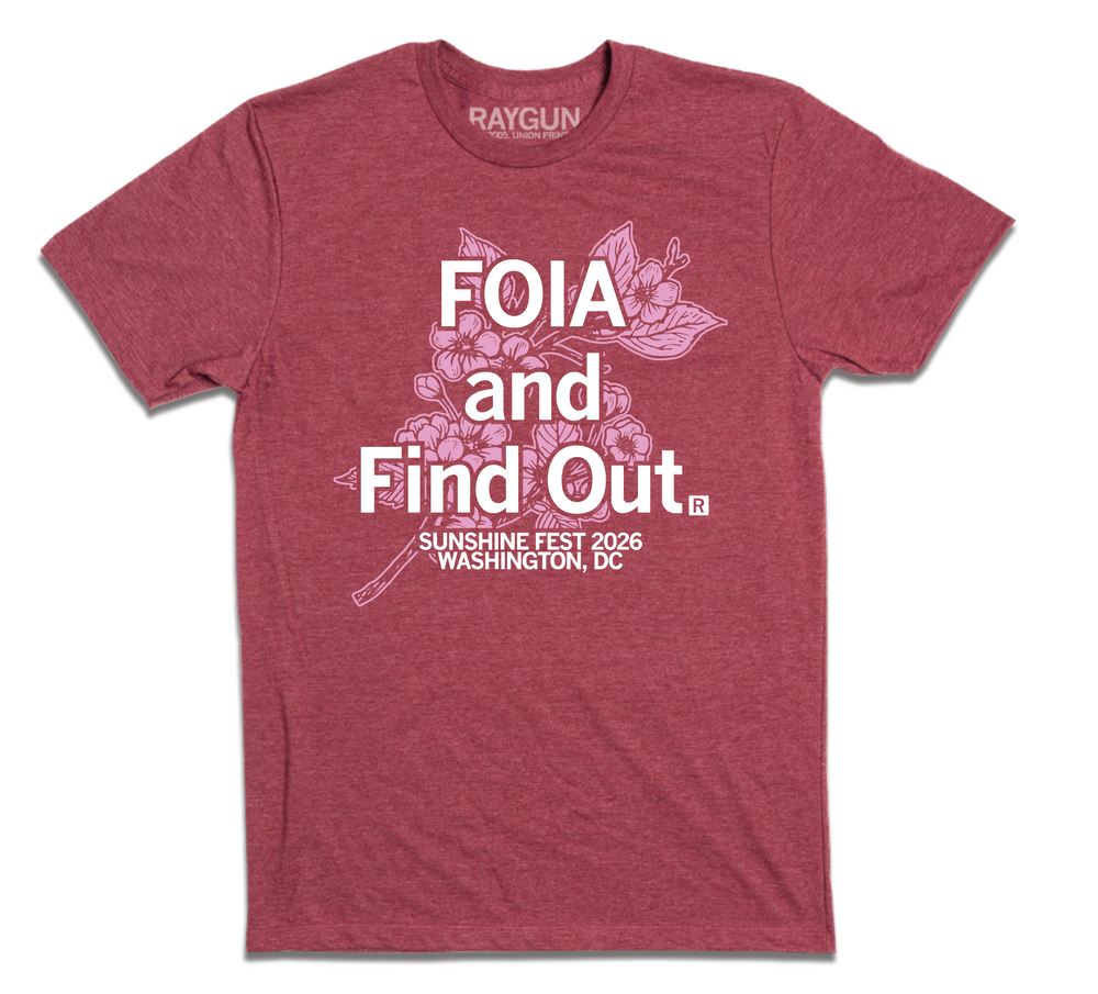 A heather burgundy t-shirt with white ink text that reads "FOIA and Find Out. Sunshine Fest 2026 Washington, DC." on top of light pink ink illustrating cherry blossoms.