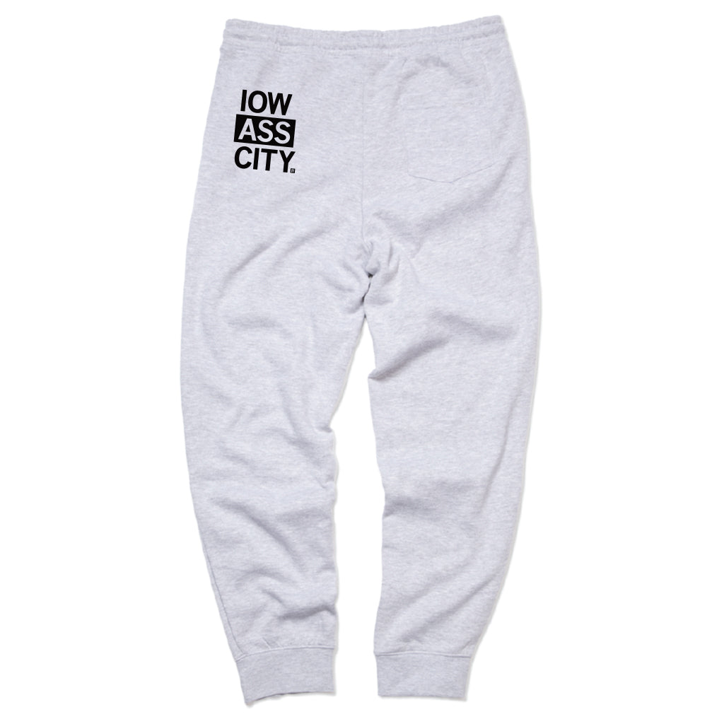 Heather gray RAYGUN sweatpants featuring IOW ASS CITY printed in a black square on the back right pocket area.
