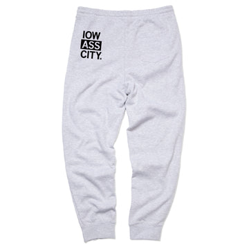Heather gray RAYGUN sweatpants featuring IOW ASS CITY printed in a black square on the back right pocket area.