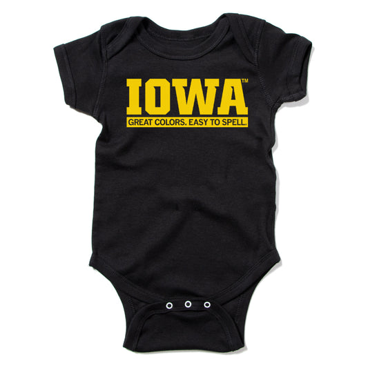 Black baby rib cotton onesie featuring the word IOWA and the text GREAT COLORS. EASY TO SPELL. in yellow, a classic RAYGUN design.