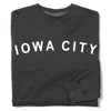 Dark gray RAYGUN crewneck sweatshirt with IOWA CITY printed in white capital letters across the chest.