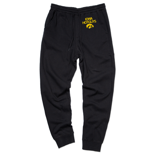 Black Union Labor sweatpants with a drawstring waist and yellow Iowa Hotguys text above a tiger hawk logo on the left hip.