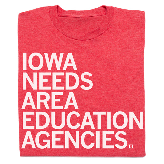 A red, union-made t-shirt with the white text IOWA NEEDS AREA EDUCATION AGENCIES.