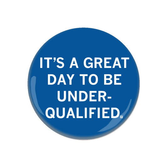 Blue circular RAYGUN button with white text that reads, ITS A GREAT DAY TO BE UNDER-QUALIFIED.