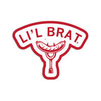 A die-cut sticker of "Li'l brat" over an image of a bratwurst on a fork.