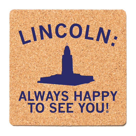 Square, high-density cork Lincoln coaster with a blue silhouette of the Nebraska State Capitol building, featuring the text LINCOLN: ALWAYS HAPPY TO SEE YOU!.
